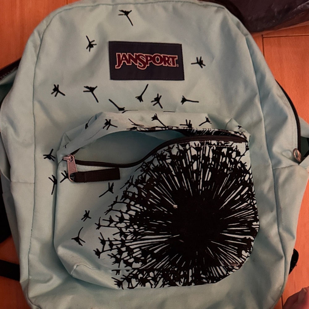 Jansport Sky Blue Backpack with Black Floral Pattern